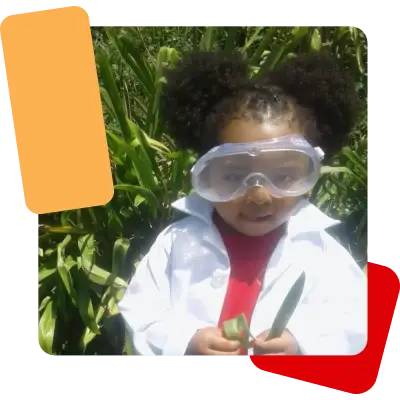 A preschool child dressed in a scientist costume.